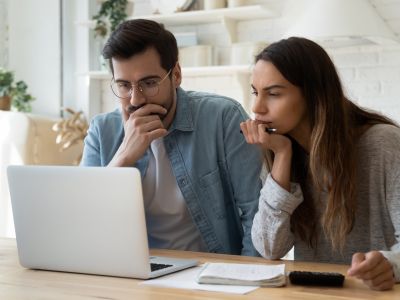 man-and-woman-struggle-with-taxes-at-computer